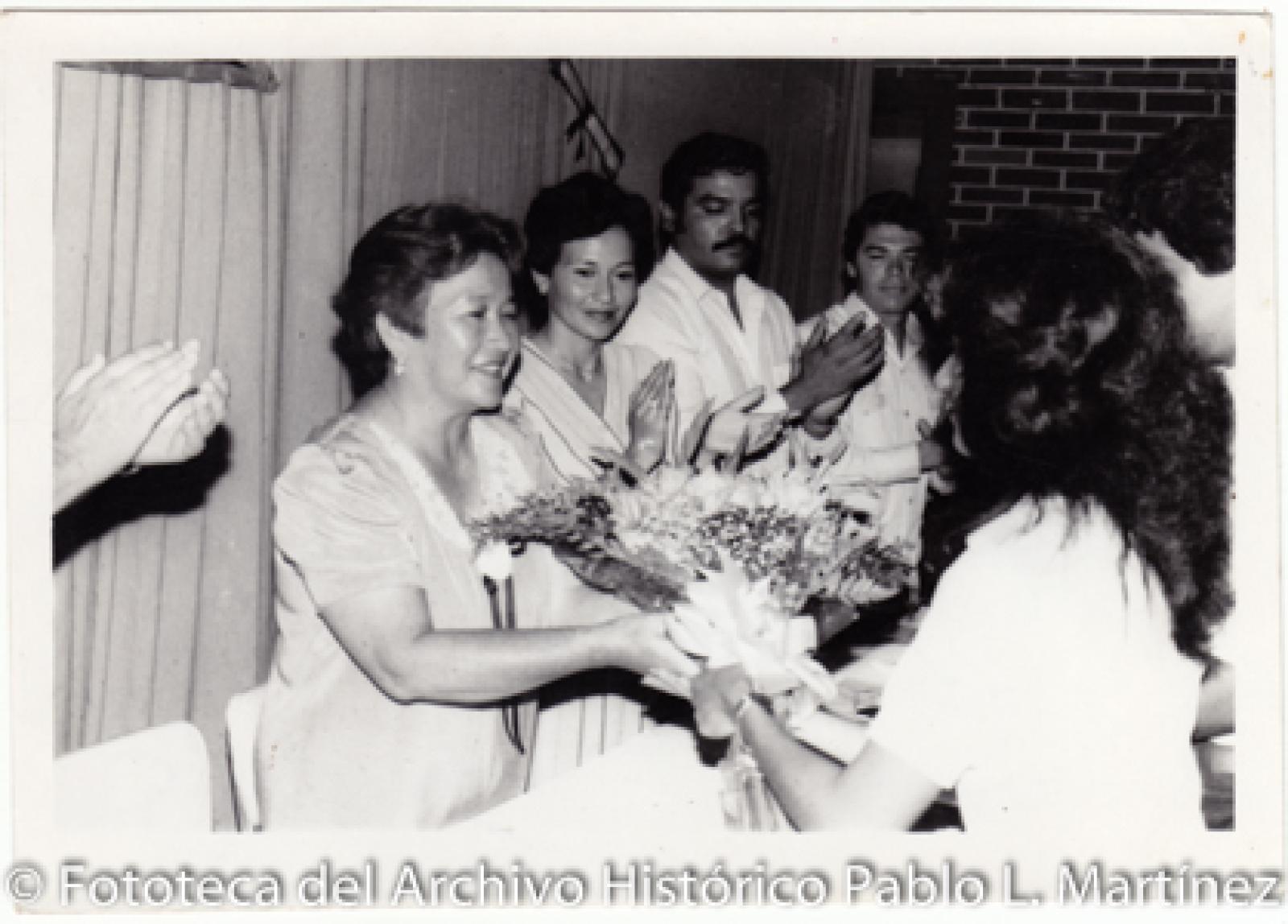 “La Profesora María Luisa”.